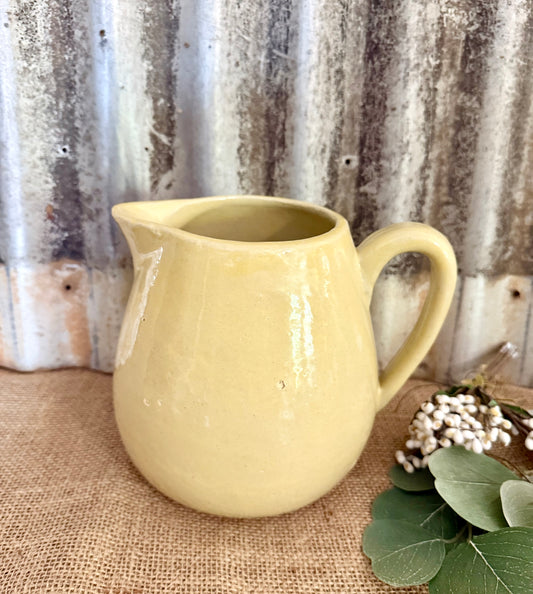 Yellow Pottery Pitcher