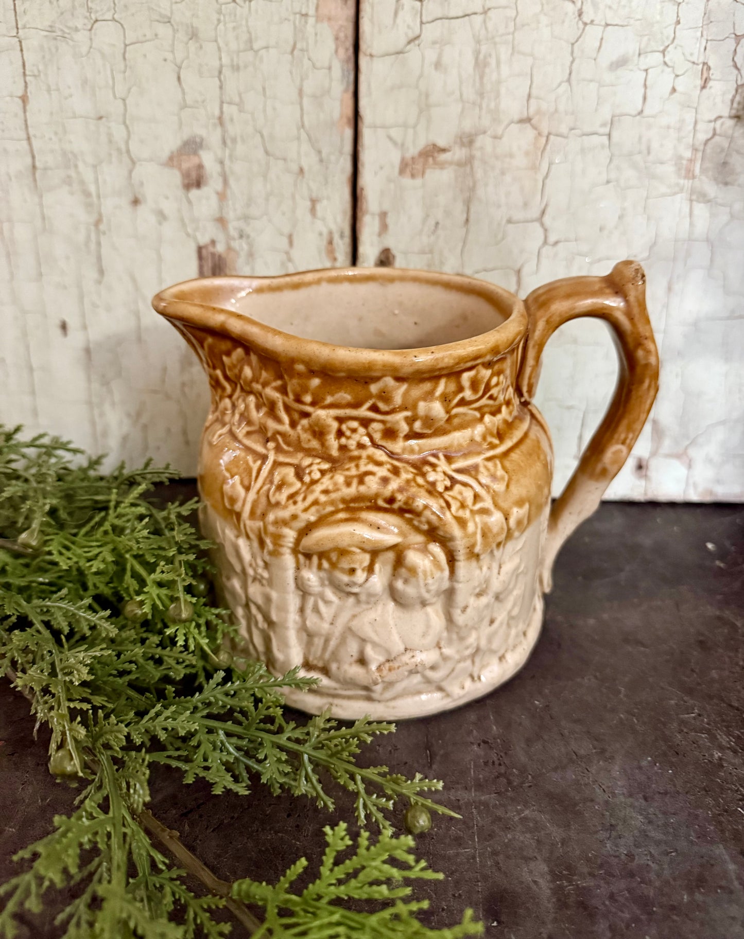 Vintage European Stoneware Pitcher – Embossed Village Scene, Caramel Glaze